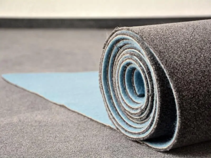 Carpet being rolled out Carpet being rolled out